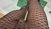 Big cock man cumming hard through black netlike tights in the bath - Image # 1