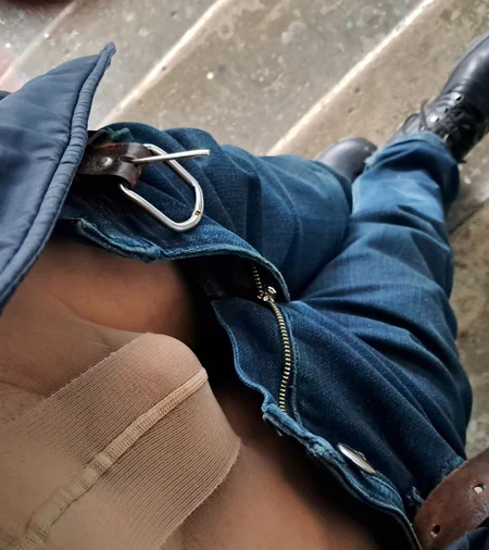 Man posing in women's pantyhose under jeans outdoor - Image # 2