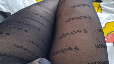 Guy shows off his long legs covered by black fashion tights