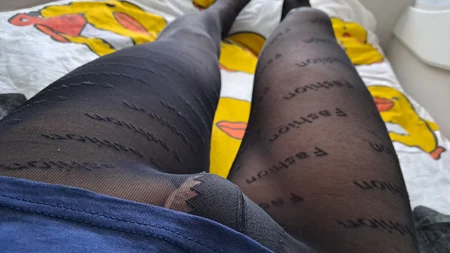 Guy shows off his long legs covered by black fashion tights - Image # 3