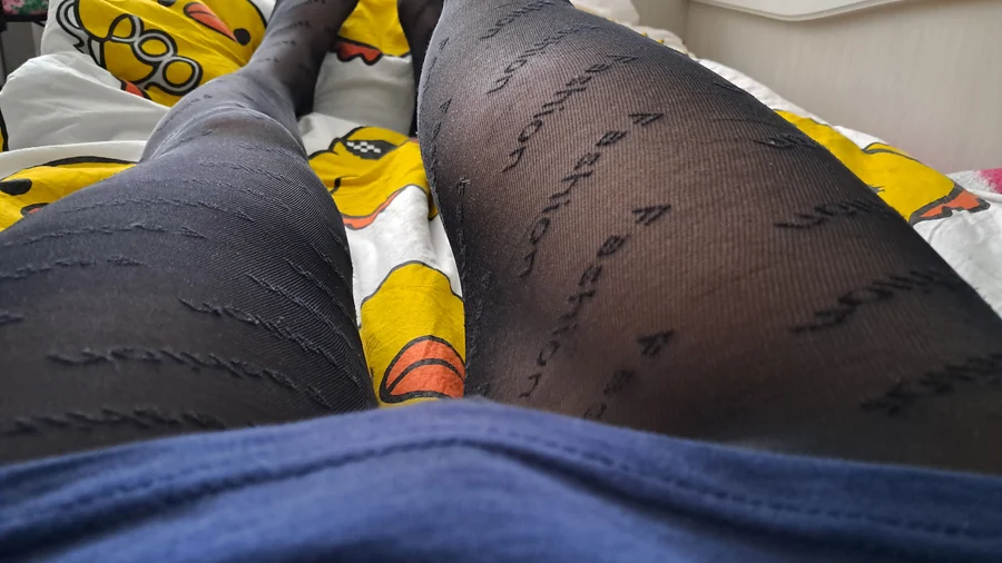 Image gallery: Guy shows off his long legs covered by black fashion tights