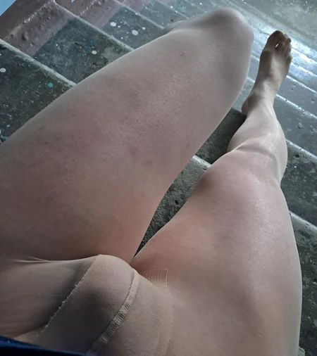 Crossdresser shows off his perfect nyloned legs - Image # 1