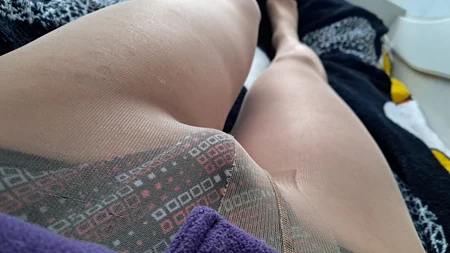 Man wearing suntan pantyhose teases on the bed - Image # 2
