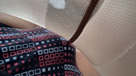 Man wearing suntan pantyhose teases on the bed - Image # 7