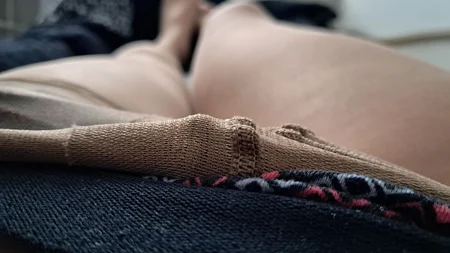 Man wearing suntan pantyhose teases on the bed - Image # 13