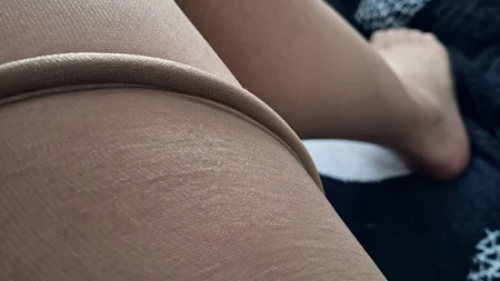Man wearing suntan pantyhose teases on the bed - Image # 17