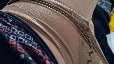 Man wearing suntan pantyhose teases on the bed - Image # 18