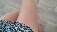 Crossdresser wearing blue dress cums under transparent nylons - Image # 1
