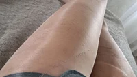 Pantyhose ripping action - crossdresser rips shiny tights on himself - Image # 2