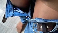 The guy takes off his jeans and shows off the control-top pantyhose underneath - Image # 1