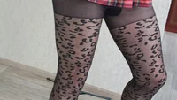 Slender crossdresser wearing black leopard pantyhose poses sexy and masturbates cock till orgasm - Image # 2