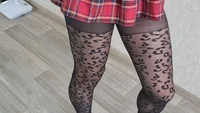 Slender crossdresser wearing black leopard pantyhose poses sexy and masturbates cock till orgasm - Image # 4