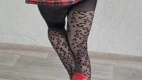 Slender crossdresser wearing black leopard pantyhose poses sexy and masturbates cock till orgasm - Image # 21