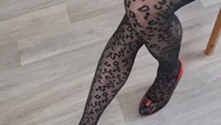 Slender crossdresser wearing black leopard pantyhose poses sexy and masturbates cock till orgasm - Image # 25