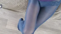 Guy sissy in blue tights is jumping on the sofa - Image # 3